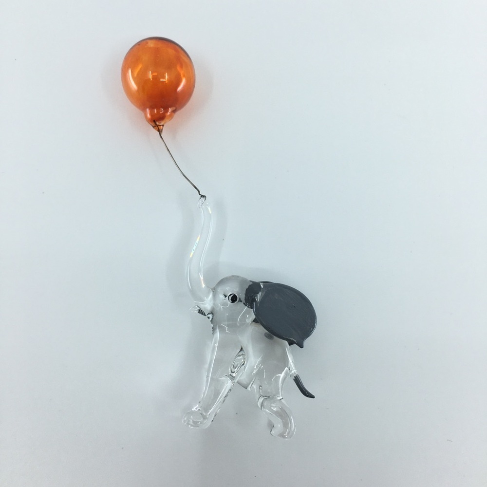 Hand-blown glass figurine resembles a circus elephant